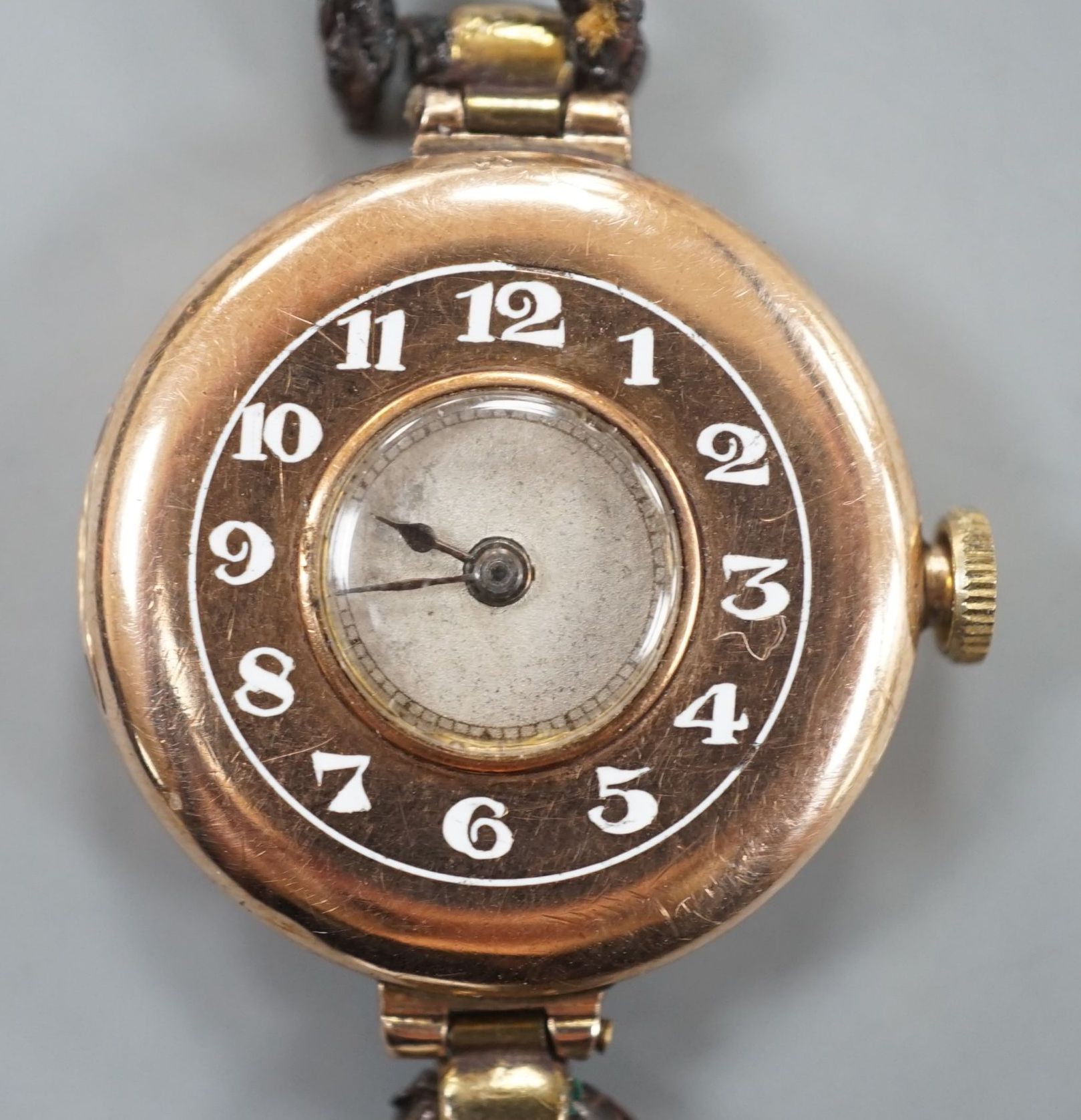 A lady's George V 9ct gold Rolex manual wind wrist watch, with Arabic chapter ring, case hallmarked for London, 1919, on a leather strap, case diameter 26mm, gross weight 16.2 grams.